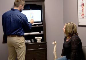 Chiropractor Traverse City MI Dr. Kyle Konas With Patient